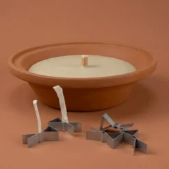 Spring-loaded wick holder
